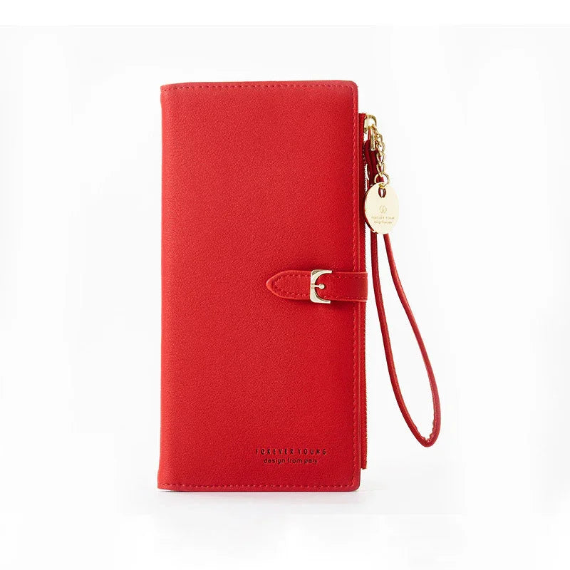 Red leather wristlet wallet with gold buckle and zipper charm on white background
