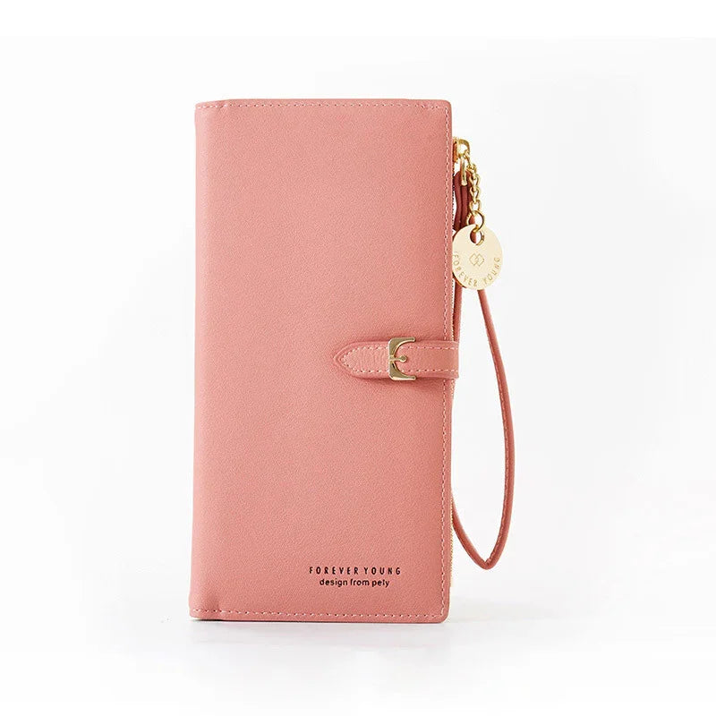 Pink faux leather wallet with wrist strap, gold buckle, and Forever Young logo