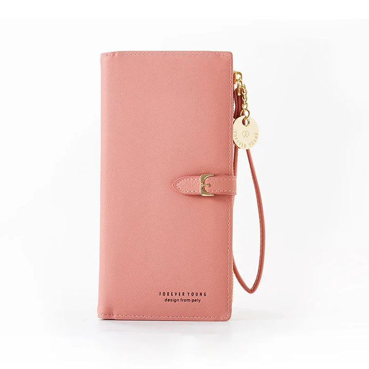 Pink faux leather wallet with wrist strap, gold buckle, and Forever Young logo