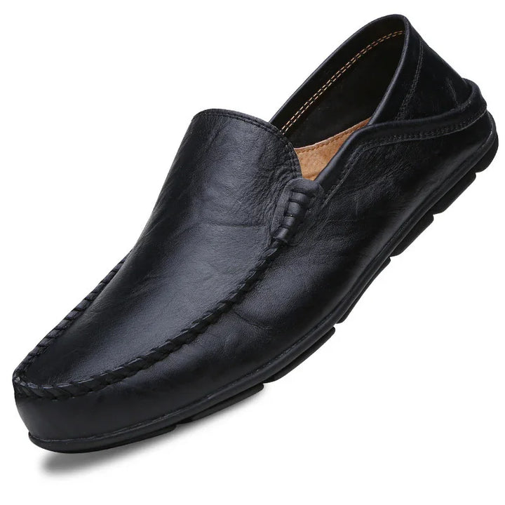 Black leather men's slip-on loafer shoe with stitched moc toe and soft sole