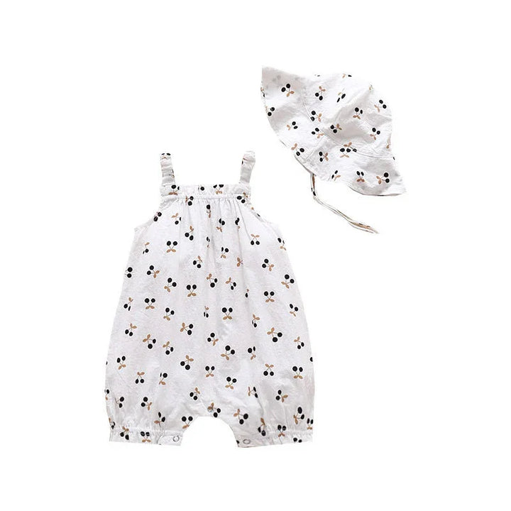 White baby romper and matching sun hat with black and beige cherry print pattern