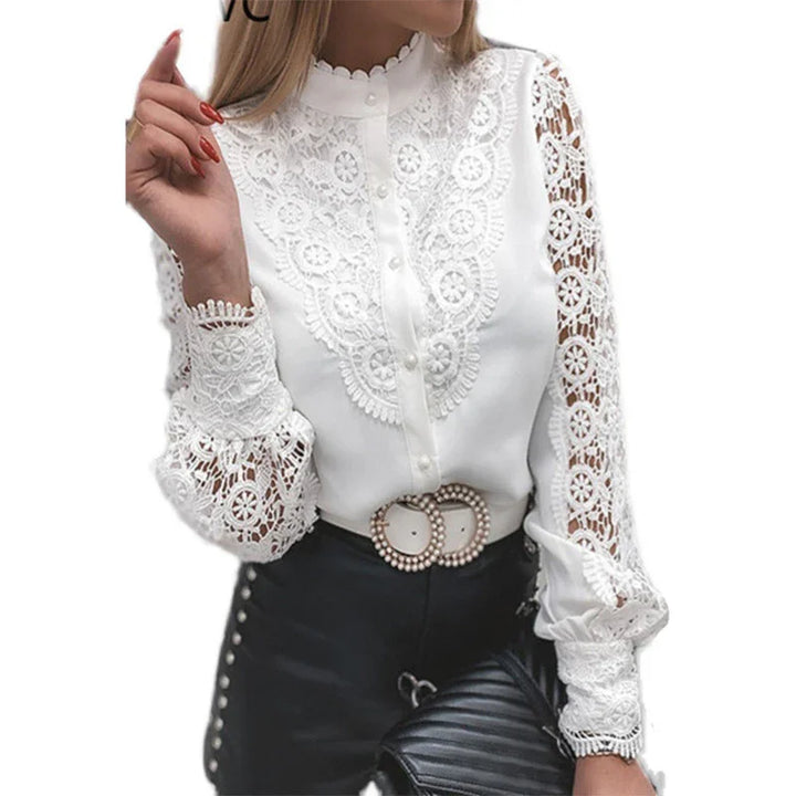 White lace blouse with scalloped collar, floral crochet sleeves, pearl button details, and double pearl belt