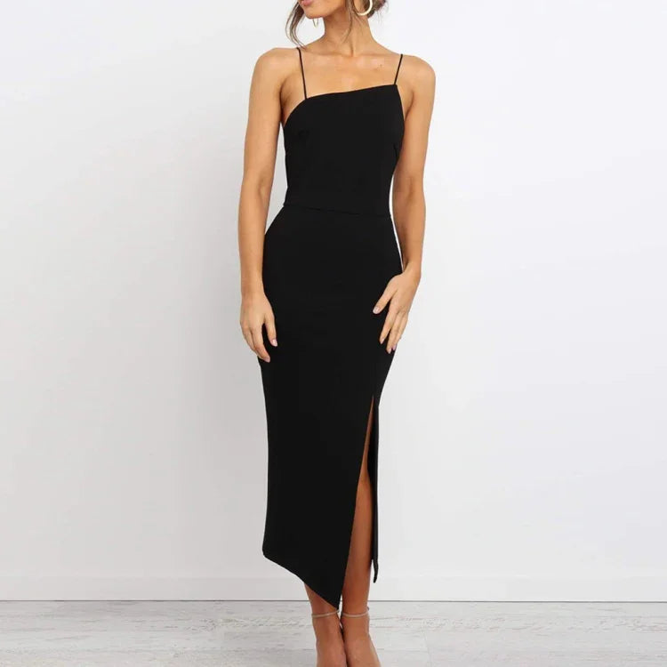 woman wearing elegant black spaghetti strap midi dress with side slit against white background