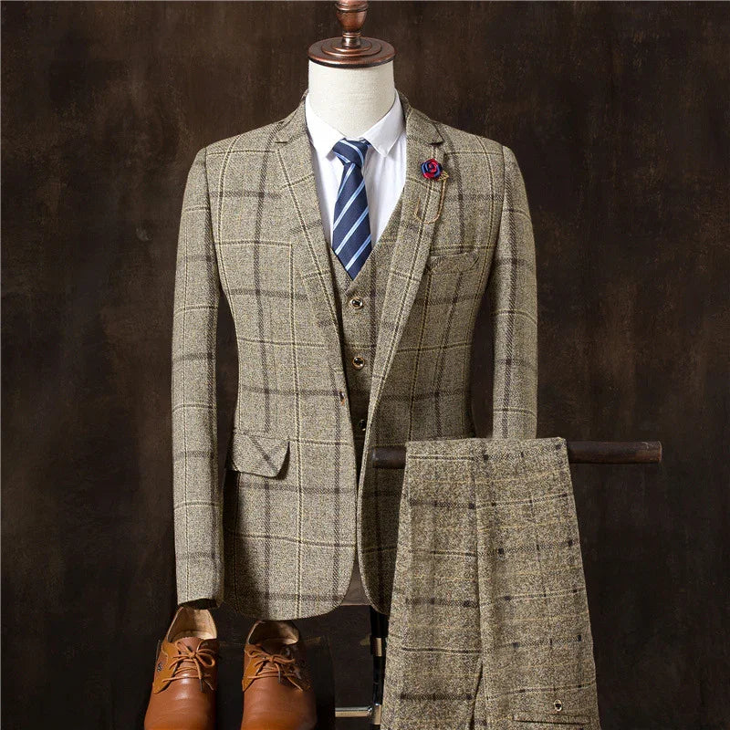 Men's brown plaid tweed suit with vest, white shirt, striped tie, and brown leather shoes on mannequin