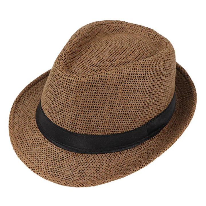 Brown woven fedora hat with black ribbon band isolated on white background