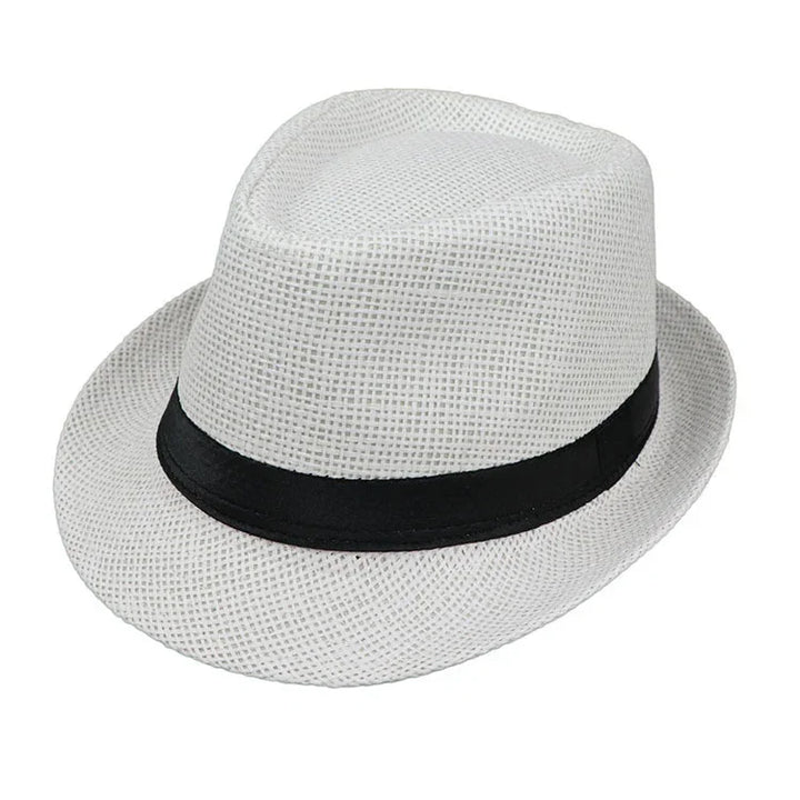 White woven fedora hat with a black band on a white background