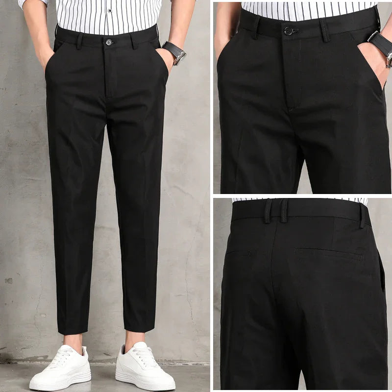 Men's black slim fit dress pants with side and back pockets, paired with white sneakers
