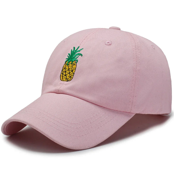 Pink baseball cap with embroidered yellow pineapple and green leaves on front
