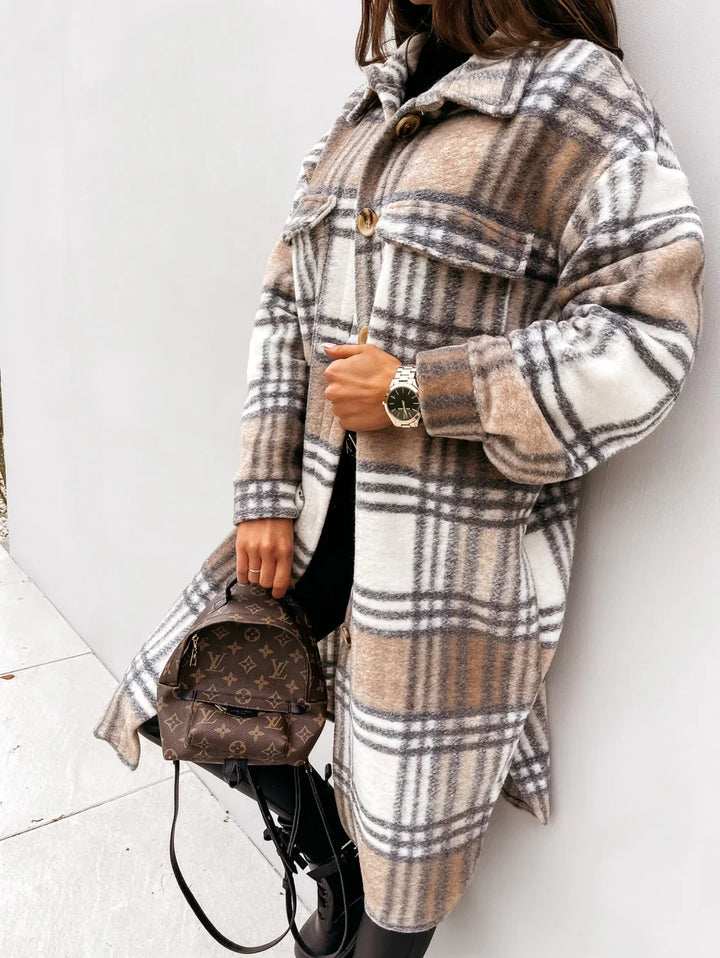 Woman wearing beige and white plaid wool coat holding brown designer Louis Vuitton mini backpack