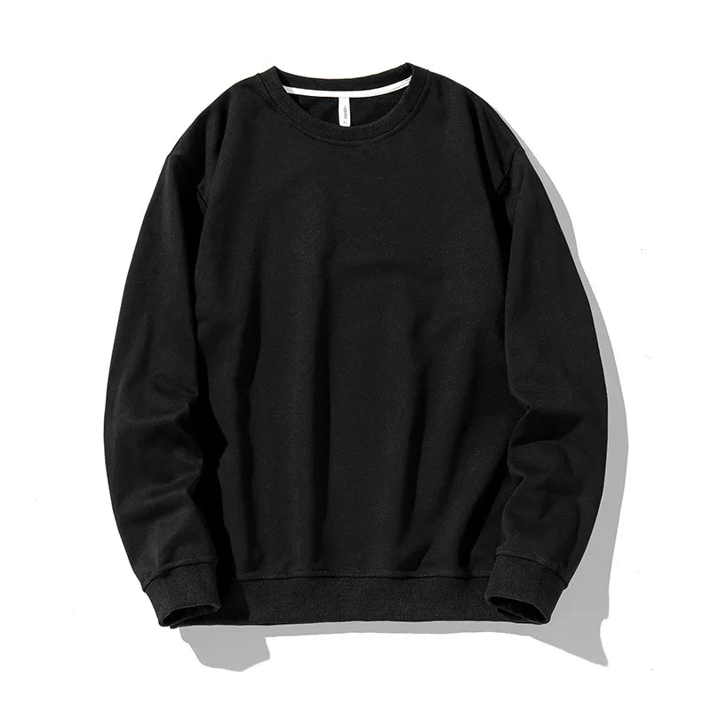 Classic black crewneck sweatshirt with long sleeves and ribbed cuffs on white background