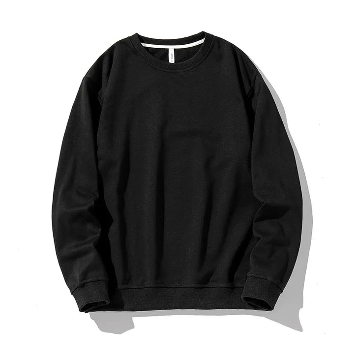 Classic black crewneck sweatshirt with long sleeves and ribbed cuffs on white background