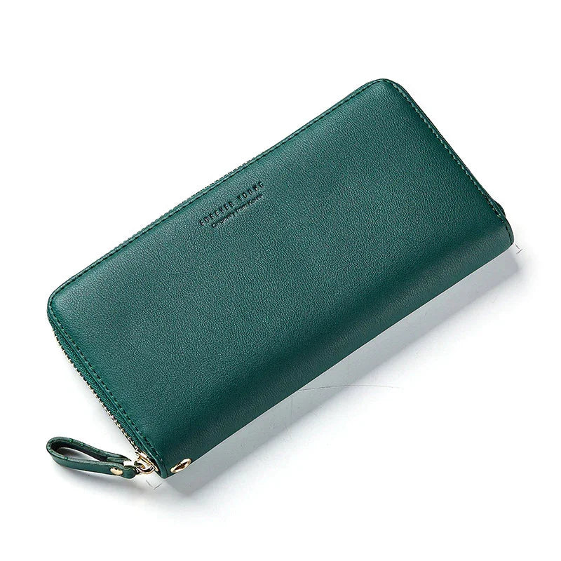 Green leather zip-around wallet with wrist strap and subtle embossed branding