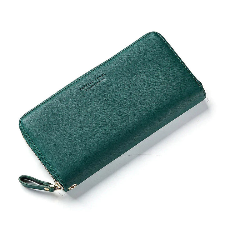 Green leather zip-around wallet with wrist strap and subtle embossed branding