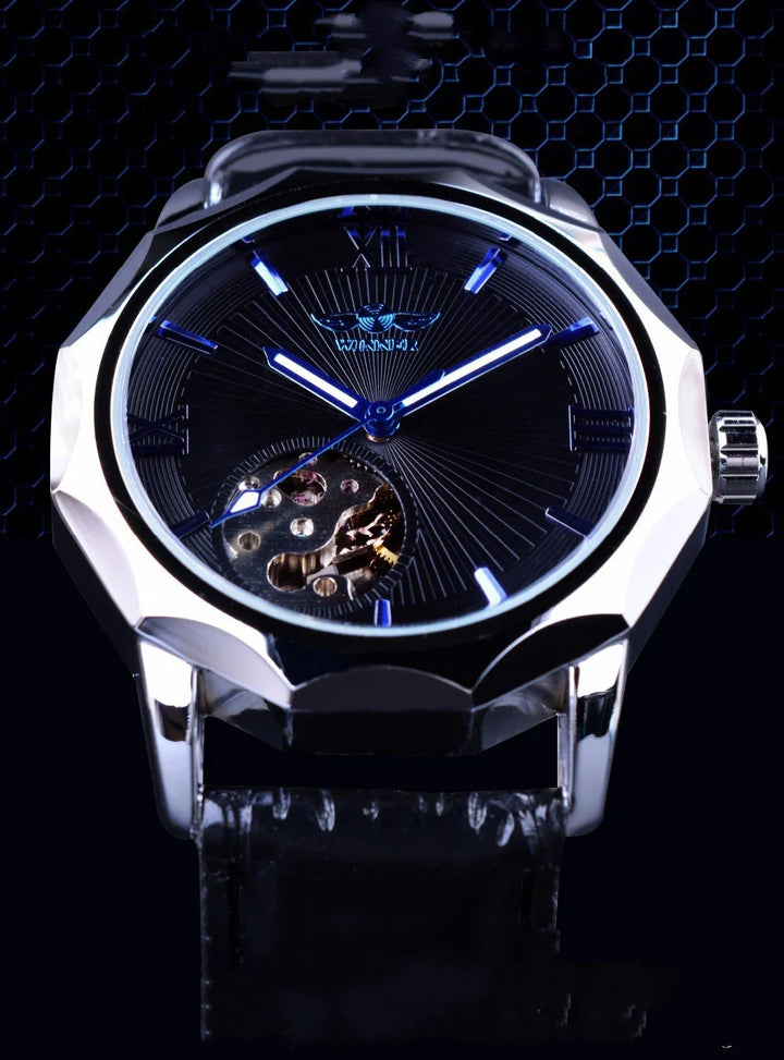 Luxury mechanical wristwatch with black dial, silver case, blue accents, and black leather strap