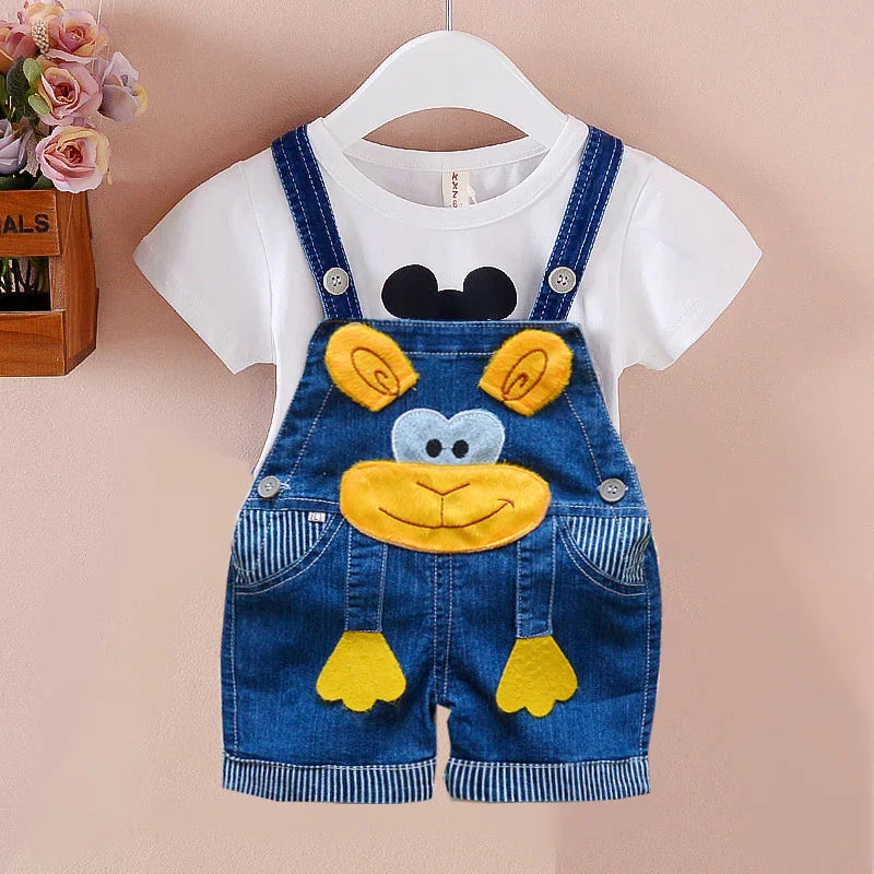 Kids denim overalls with yellow bear face and ears paired with white t-shirt featuring black cartoon print