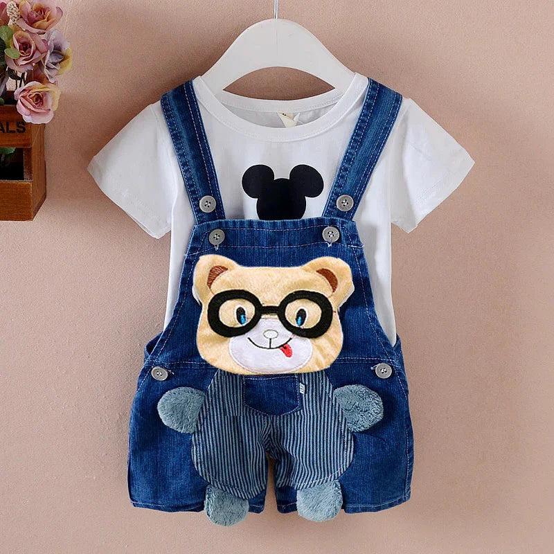 Cute toddler outfit with white Mickey Mouse t-shirt and denim overalls featuring a plush bear face with glasses