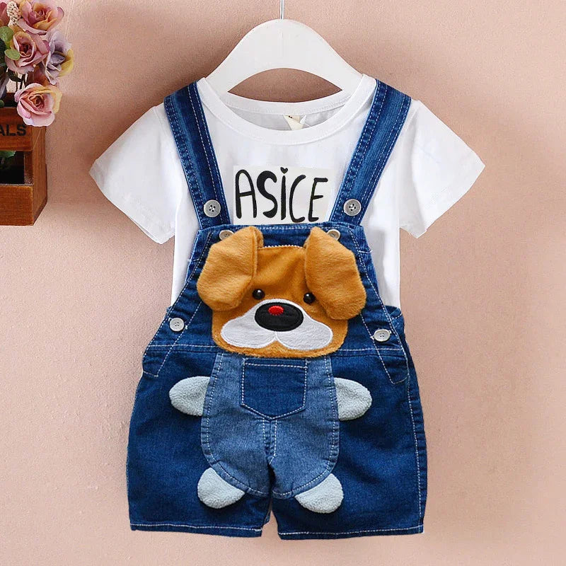 Child's denim overalls with plush dog face and white t-shirt with ASICE print on hanger