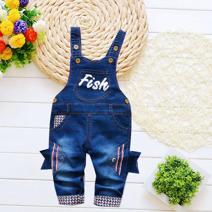 Blue denim baby overalls with fish design on legs and 'Fish' text on chest pocket