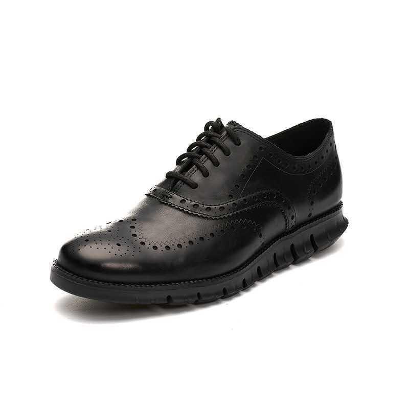 Black leather brogue men's dress shoe with wingtip design and cushioned sole