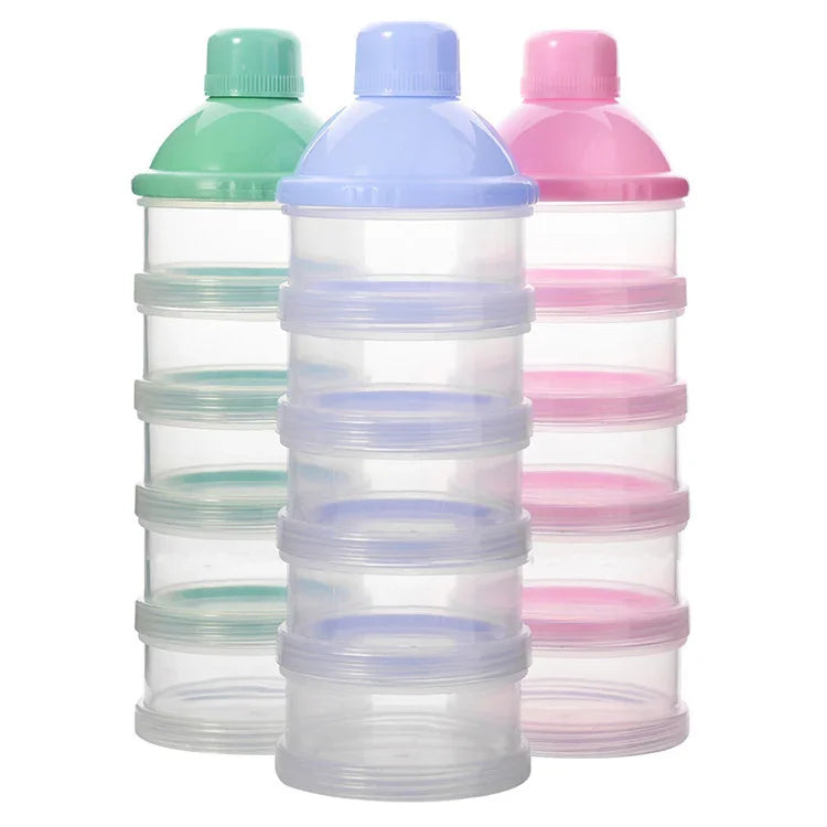 Stacked plastic storage containers with green, blue, and pink lids for organizing small items