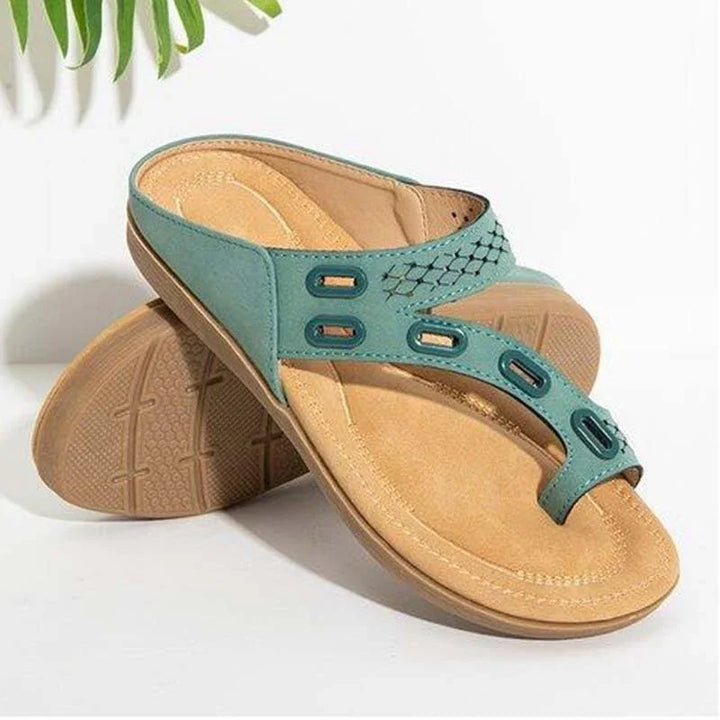 Pair of teal and tan comfortable open-toe sandals with cushioned insoles and textured soles