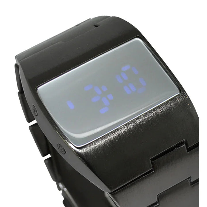Black digital wristwatch with blue LED display showing time 1:34:0 on stainless steel band