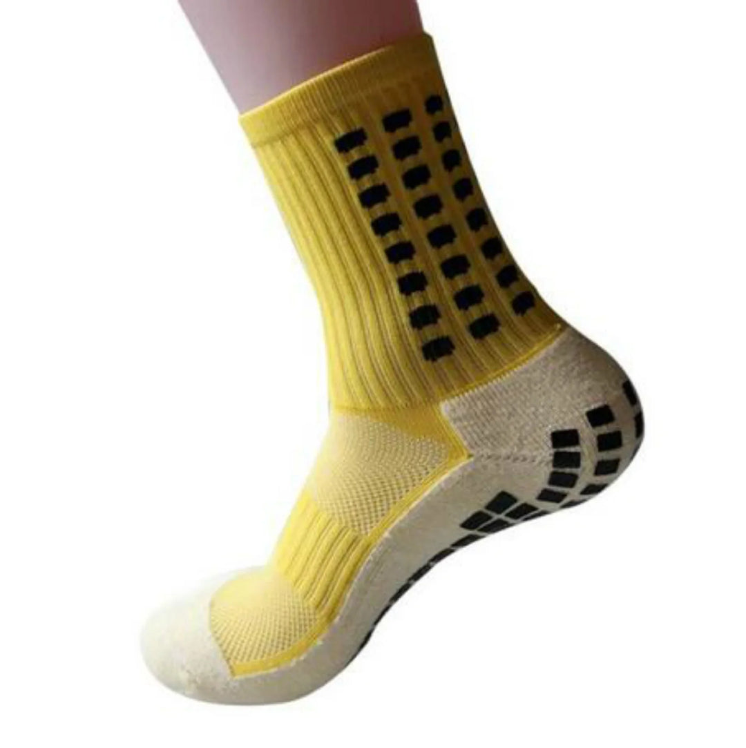 Yellow non-slip grip athletic sock with black rubber squares on ankle and sole