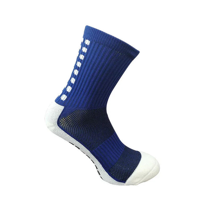 Blue athletic crew sock with white toe and anti-slip grip dots on a white background