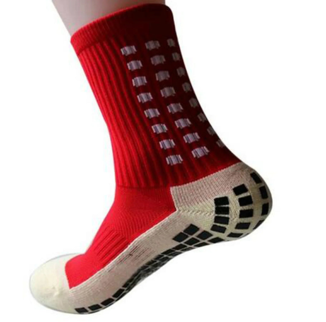 Red non-slip sports sock with white and black grip pads on heel and sole