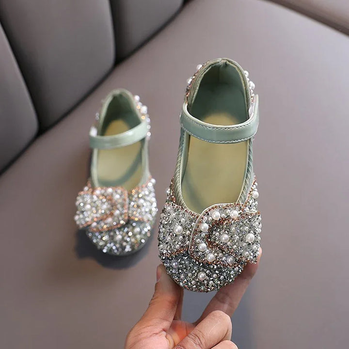 Sparkly baby girl shoes with pearls and crystals, featuring a mint green strap and buckle detail