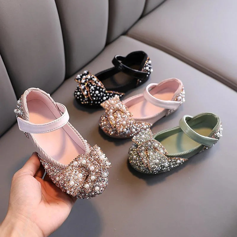 Four pairs of elegant girls' Mary Jane shoes with pearl and bead embellishments in pink, black, white, and green colors