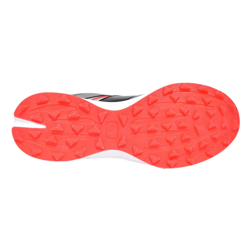 Close-up of athletic shoe sole with bright red rubber tread and triangular traction patterns