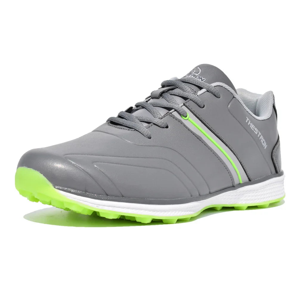 Gray sports shoe with neon green sole and accents, branded THESATRON, with laces