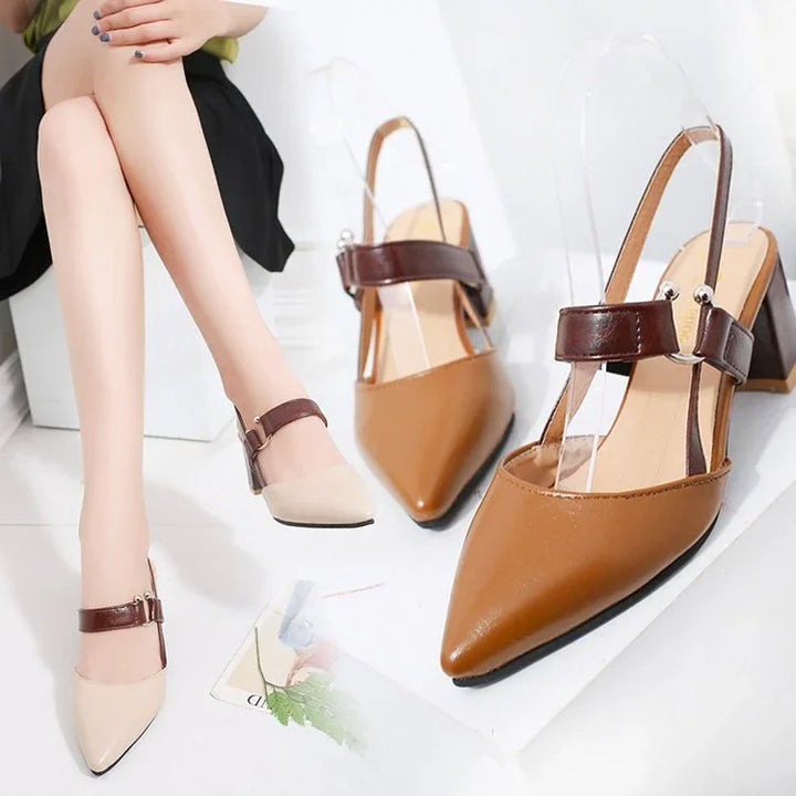 Pointed-toe block heel slingback shoes with brown ankle strap, worn and displayed on white surface