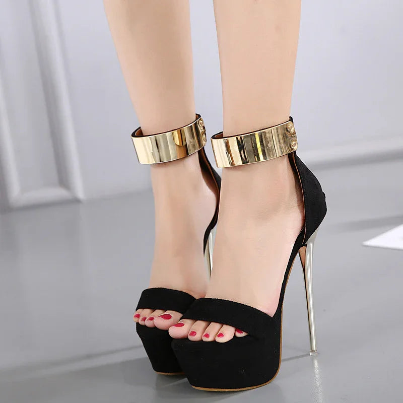 Black platform high heels with gold ankle straps and silver stiletto heels on model