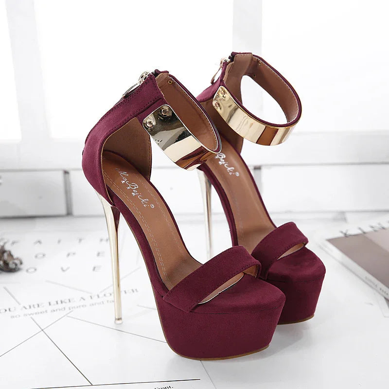Elegant burgundy platform high heels with gold metallic ankle straps and stiletto heels
