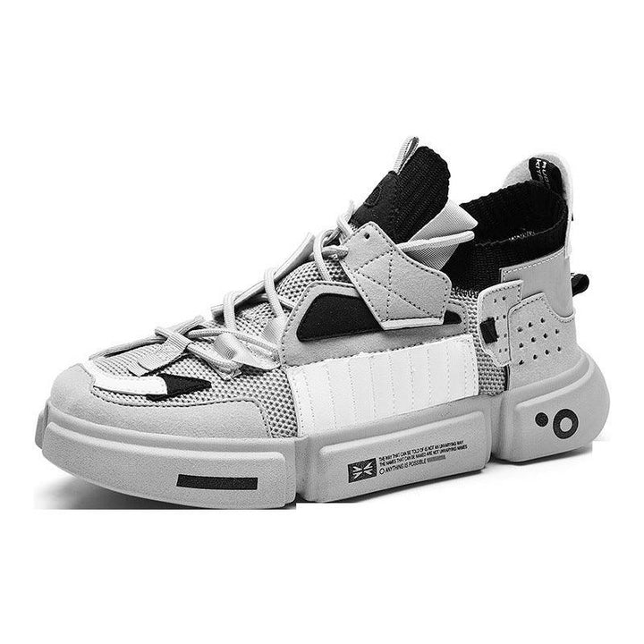 Modern high-top sneaker with black, gray, and white mesh and leather upper on thick rubber sole