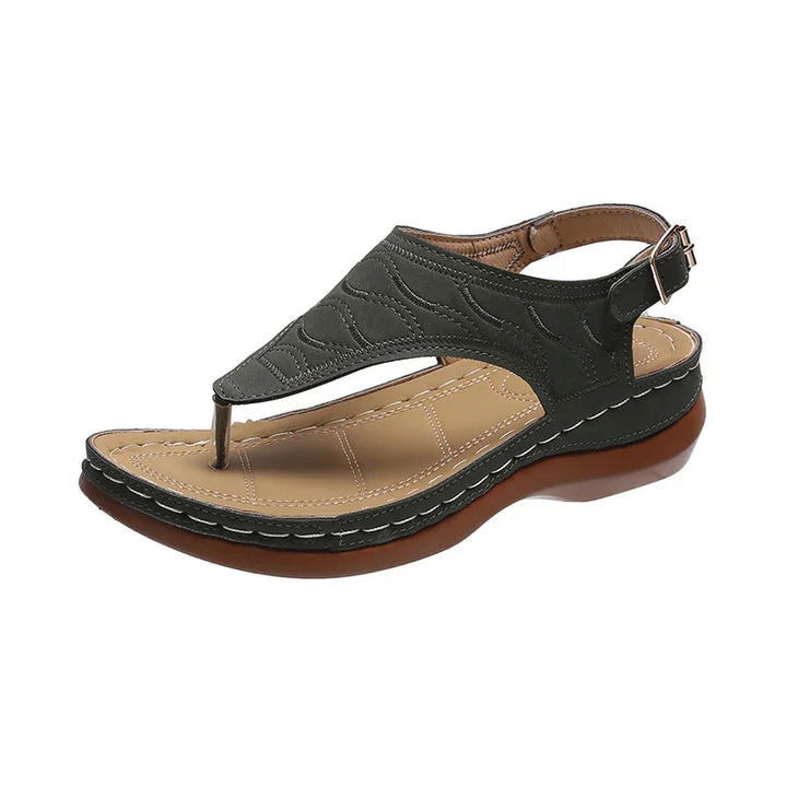 black leather women's sandal with toe post, adjustable ankle strap, and cushioned tan insole