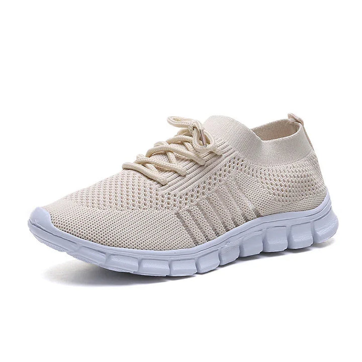 Light beige knit fabric sneaker with white flexible sole and lace-up design