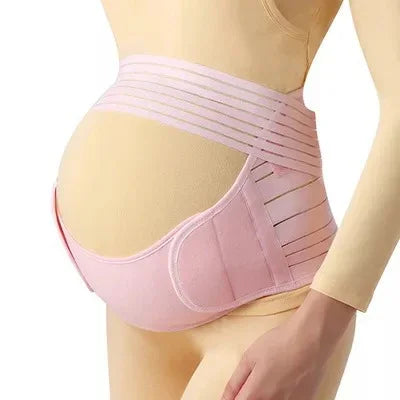 Pink maternity support belt wrapped around pregnant belly on mannequin for pregnancy care