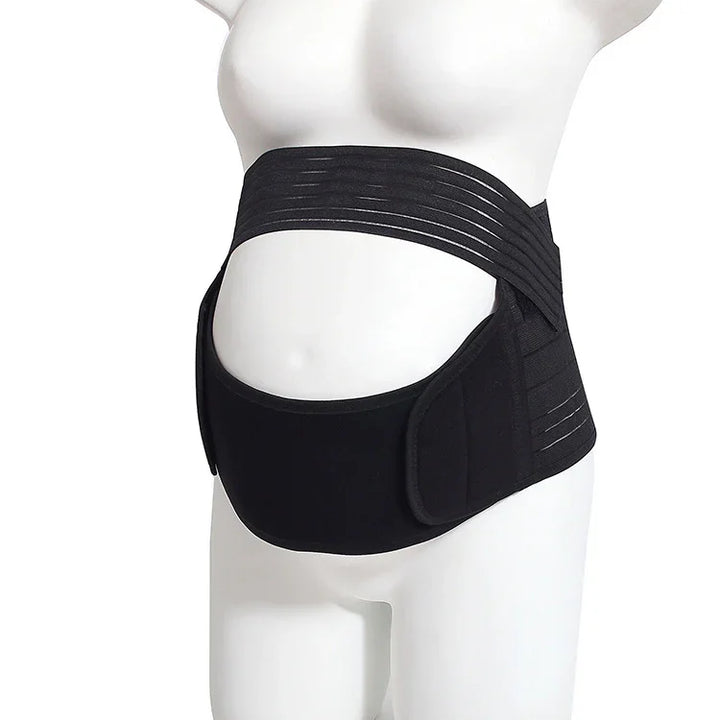 Black maternity support belt worn on mannequin for pregnancy belly support
