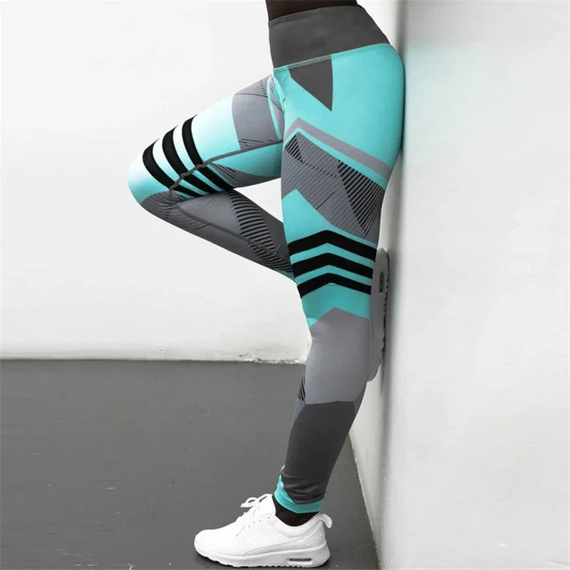 Woman wearing turquoise and gray geometric patterned leggings with white sneakers against a white wall