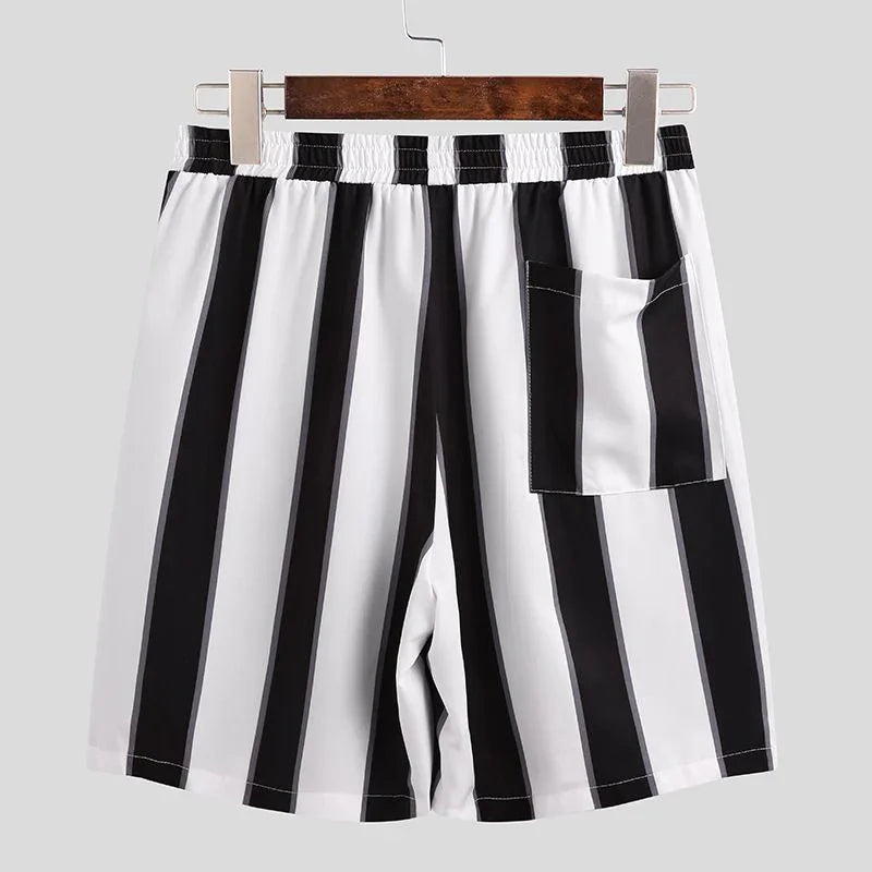 Black and white vertical striped casual shorts with elastic waistband and back pocket on hanger