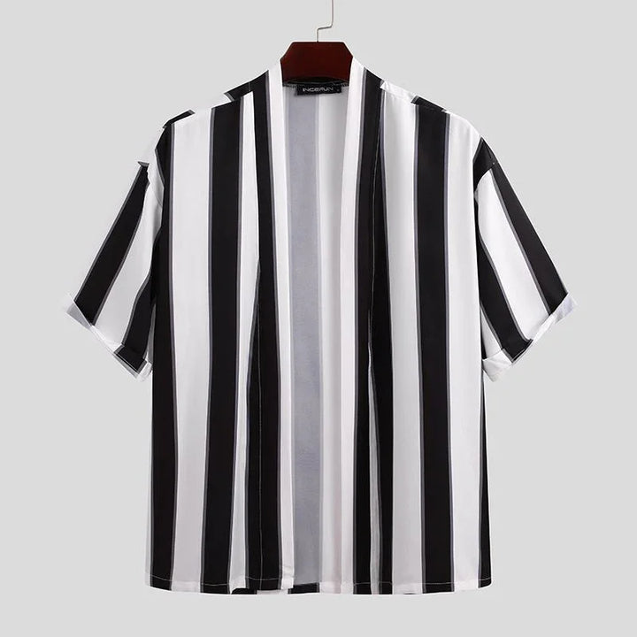 Black and white vertical striped short sleeve open front kimono jacket on hanger