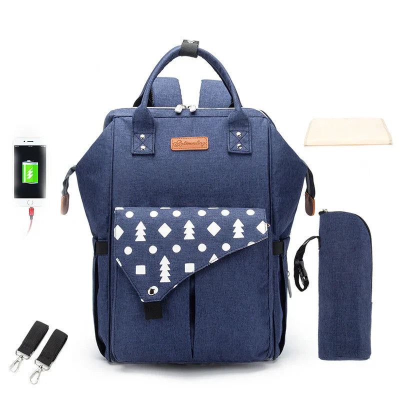 blue multifunctional diaper backpack with white tree pattern, USB charging port, changing pad, and accessories