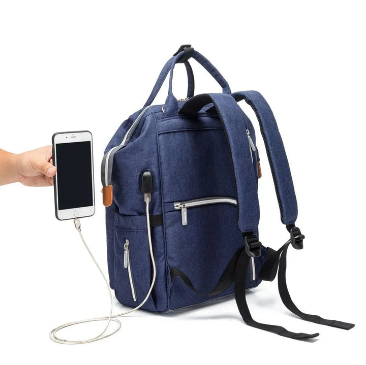 Blue backpack with USB charging port connected to a smartphone held by a hand