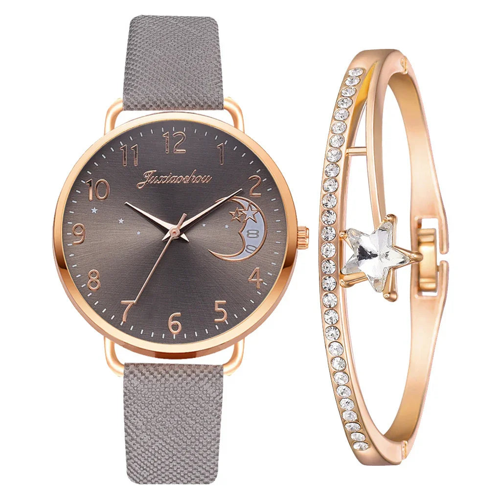 Elegant wristwatch with gray textured strap and gold-tone dial beside gold bracelet with crystal star and rhinestones