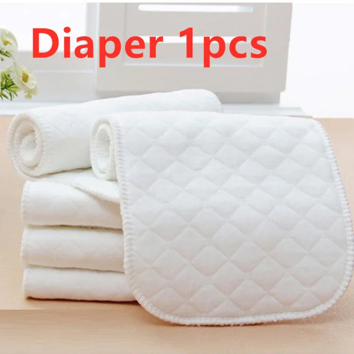 Stack of white quilted baby diapers and cloths on a wooden surface with text Diaper 1pcs