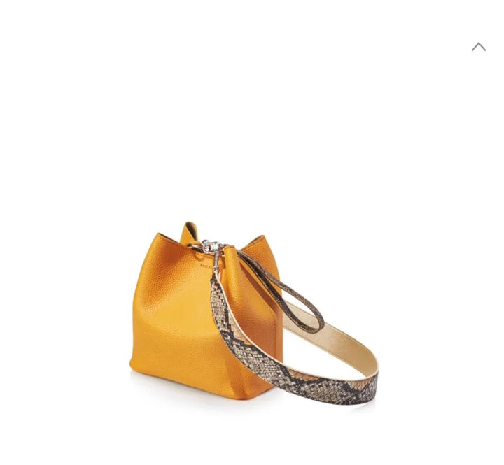 Small mustard yellow leather bucket bag with a detachable snake print wrist strap