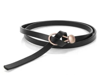 Black leather belt with round rose gold buckle on white background